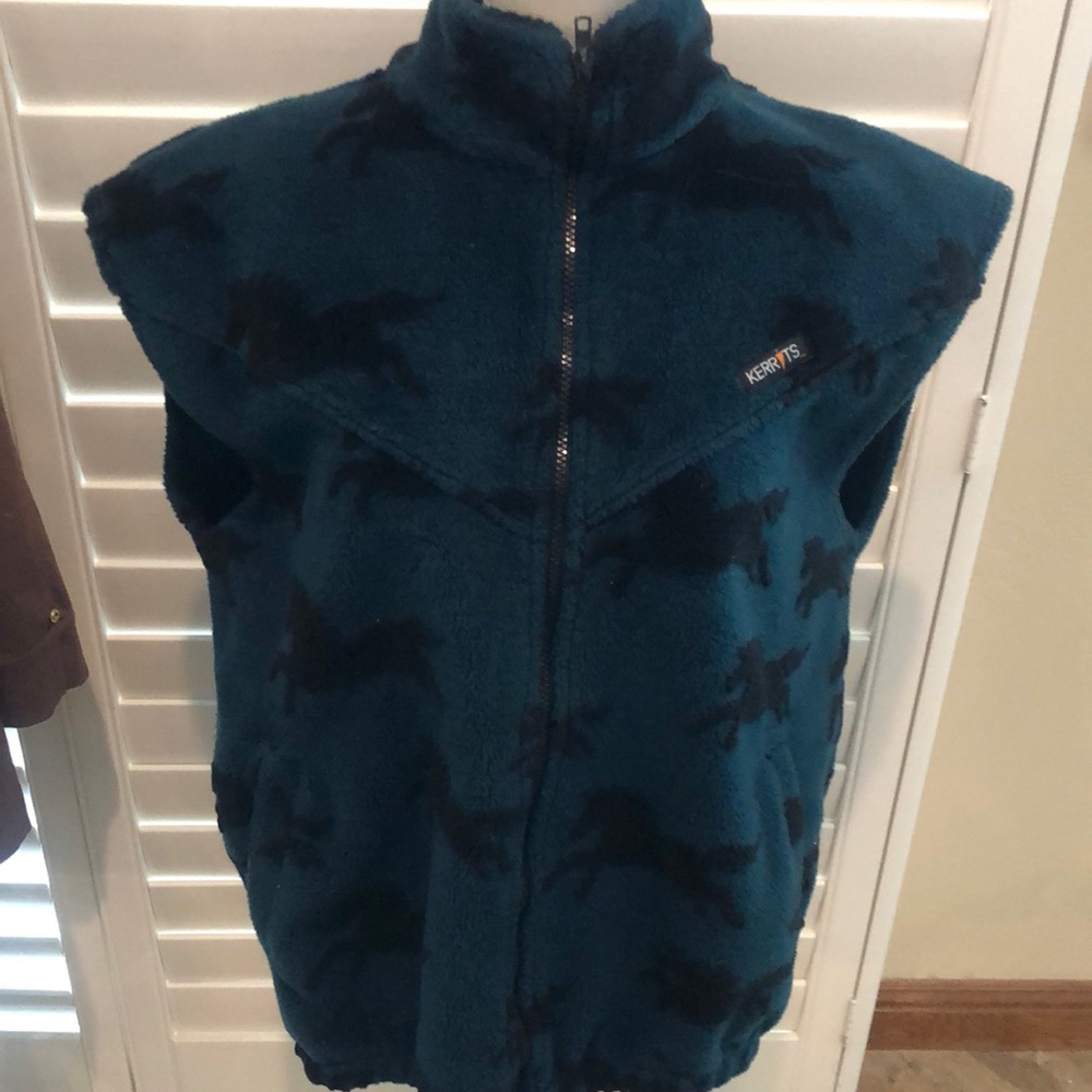 Get your cowgirl on. Warm and cozy zippered vest with two pockets. Horse themed.